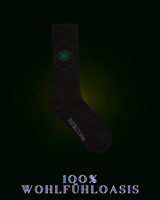 Schwarze Socken für Herren & Frauen aus 67% Baumwolle für jeden Anlasse | Sportsocken, Heimsocken mit einem grünem Zytokinesissymbol mit Hexagonaler Struktur nach goldenem Schnitt in der Mitte